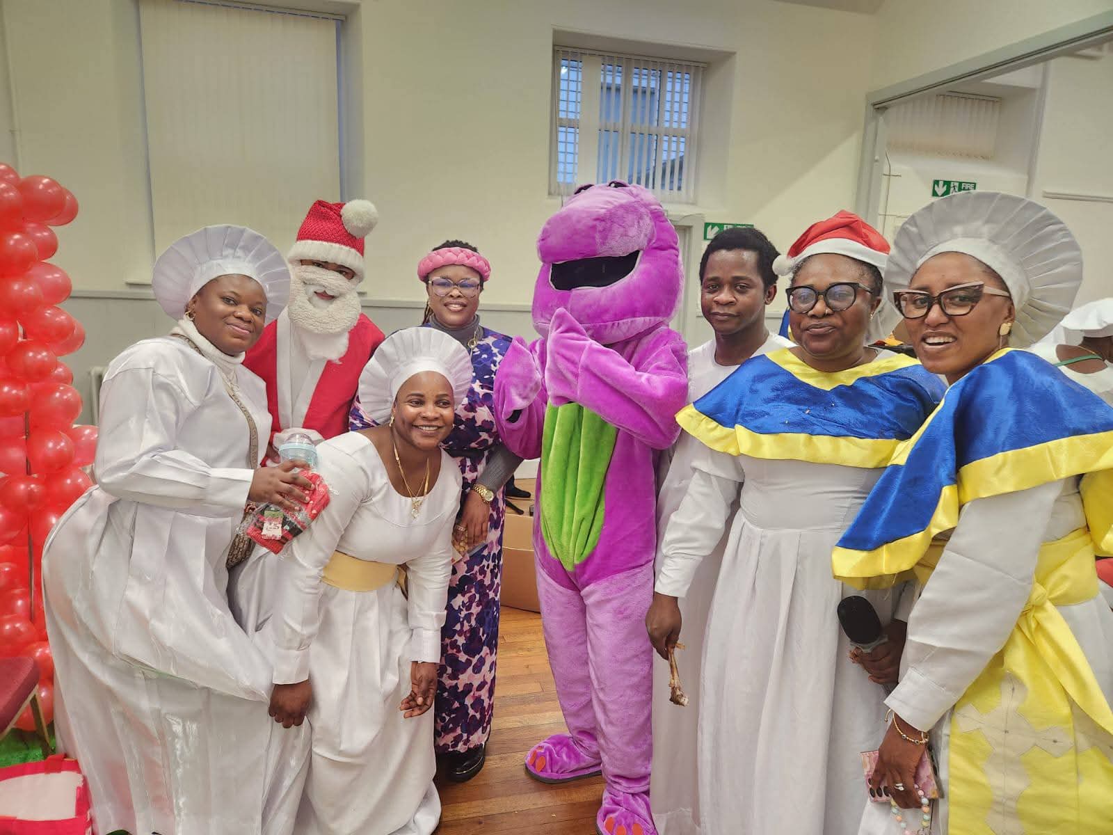 Volunteers in festive costumes posing together