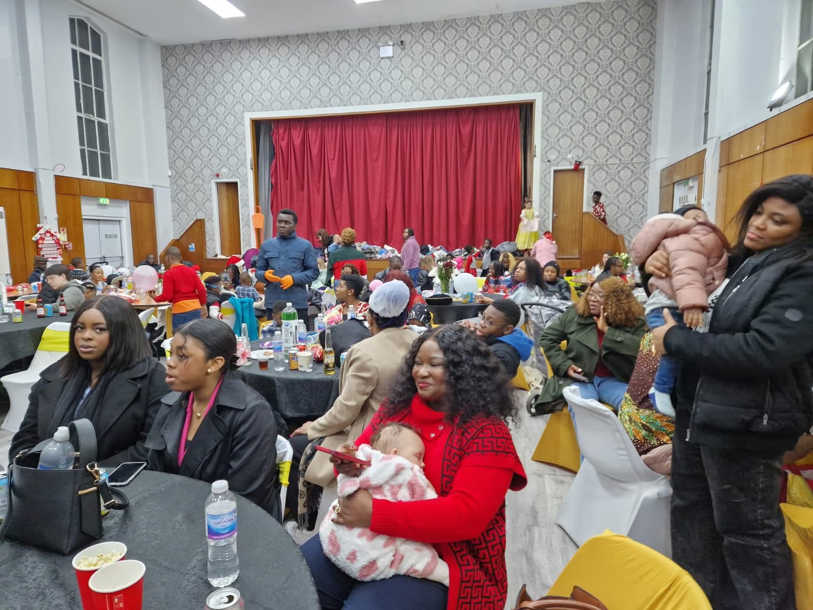 Large community gathering with festive decorations