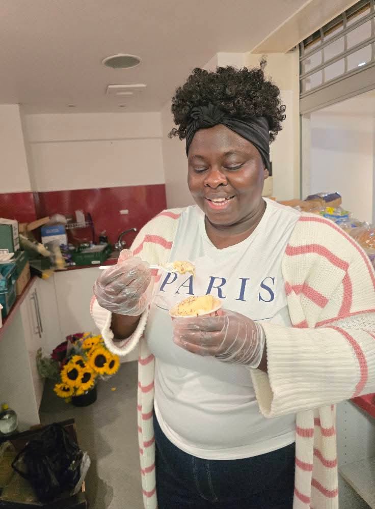 Woman preparing food in kitchen at community event
